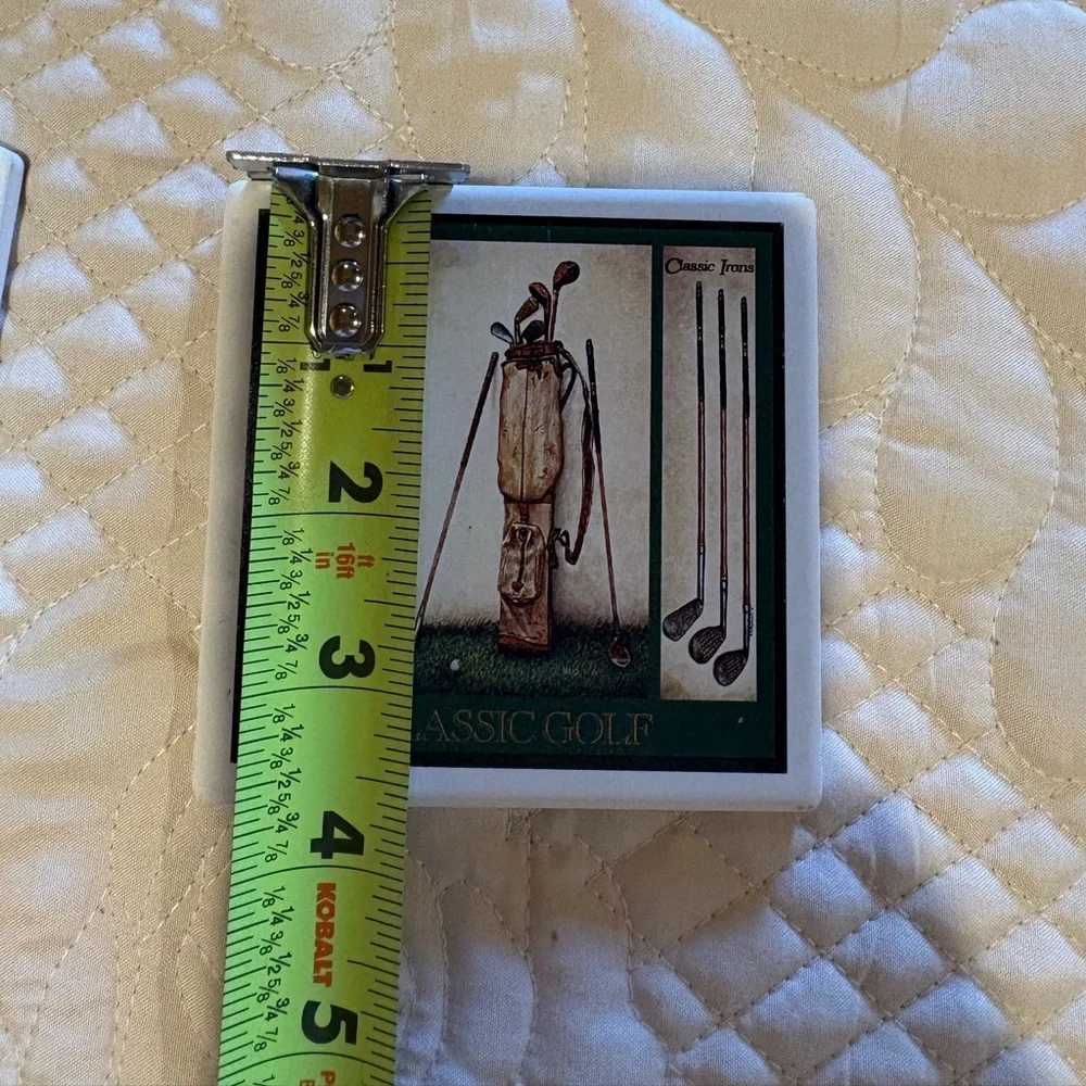Vintage ceramic coasters depicting classic golf clubs.